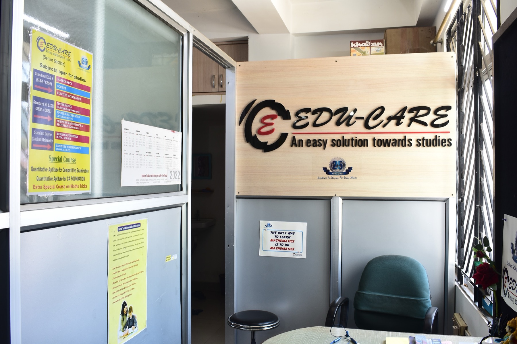 The EDU-CARE office, with the sign An easy solution towards studies on a wooden panel