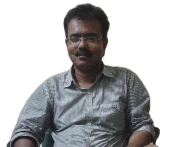 A man in glasses and a striped shirt at the EDU-CARE desk